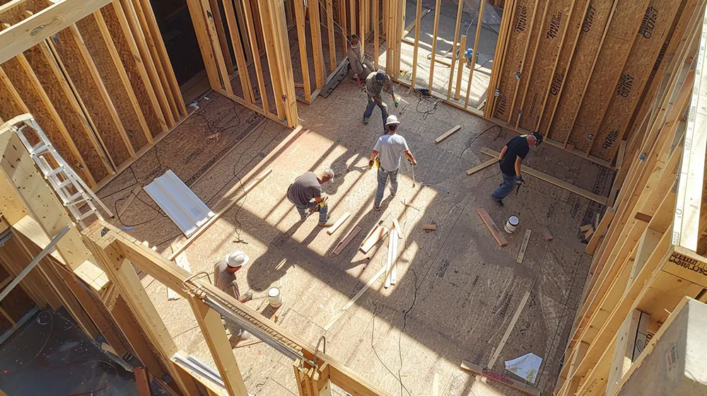 Construction workers building a home