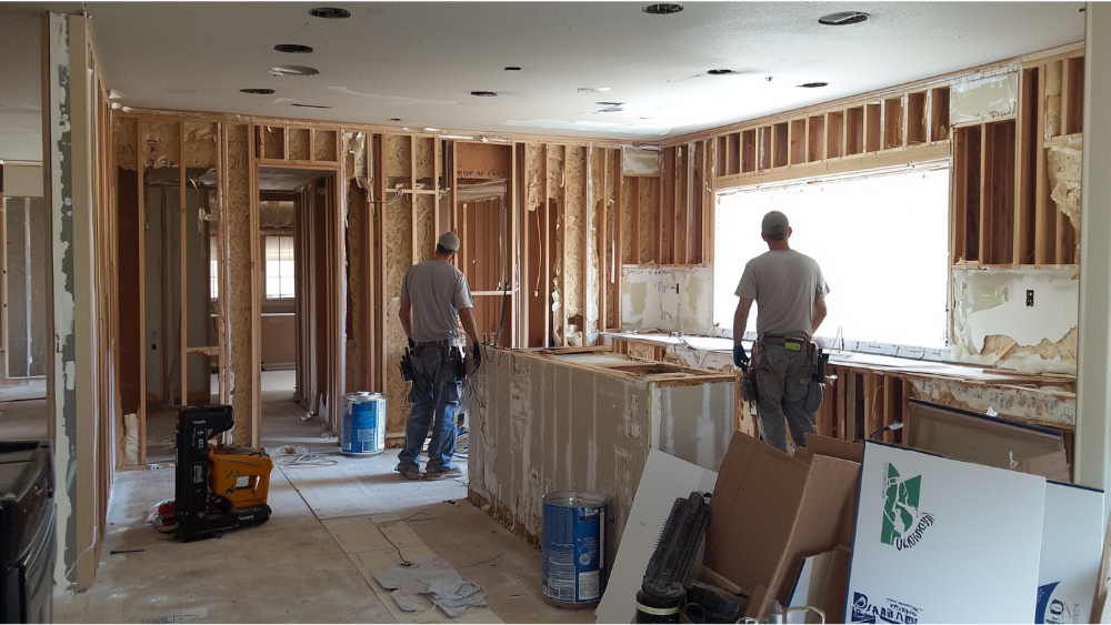 Two men remodeling a home